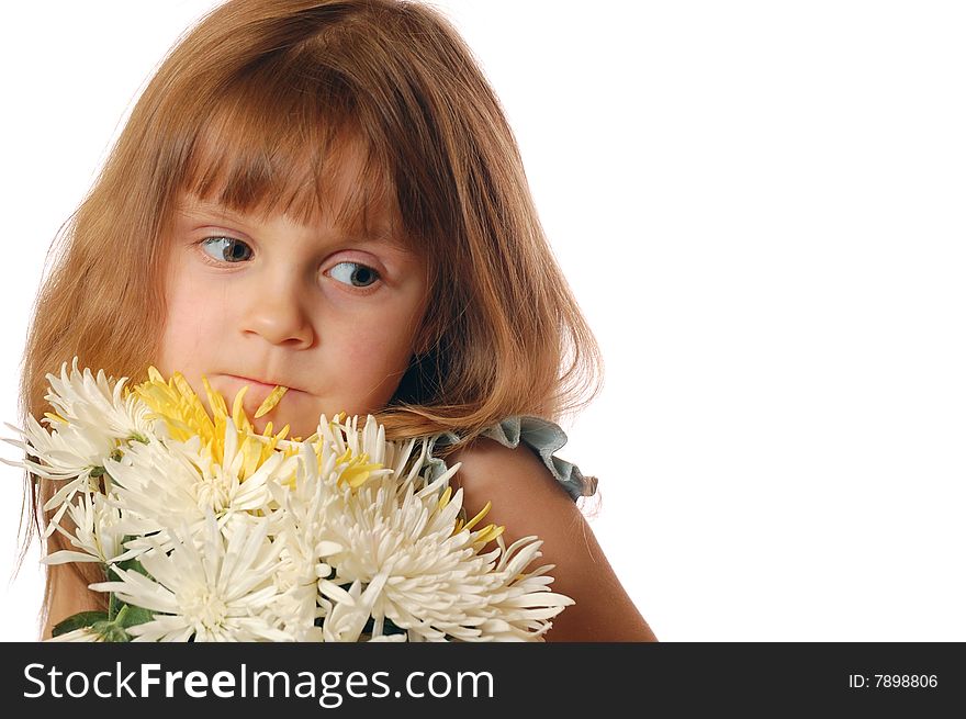 Beautiful little girl with a bunch of flowers and a pental in her lips. Copy Space. Beautiful little girl with a bunch of flowers and a pental in her lips. Copy Space.