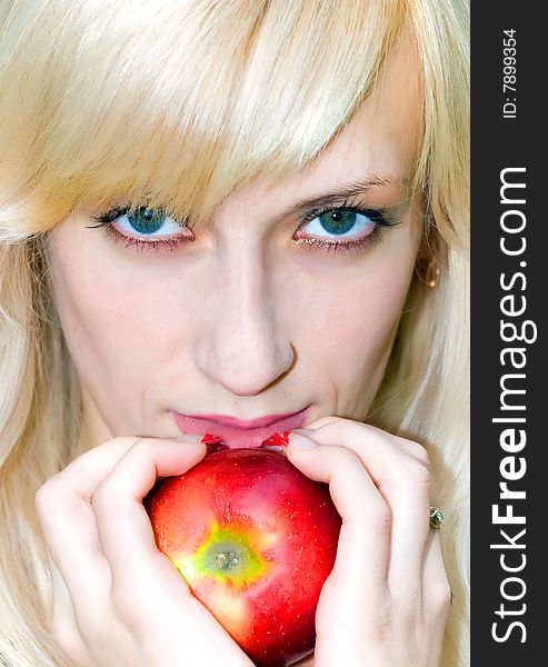 Attractive girl with apple in her hand