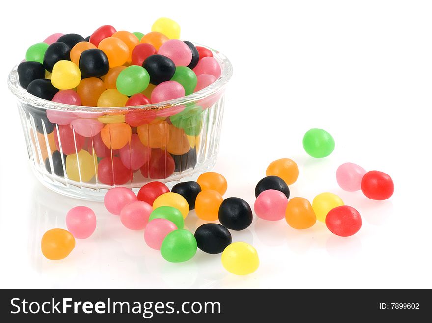 Bowl of glass filled with jellybeans isolated on white. Bowl of glass filled with jellybeans isolated on white.