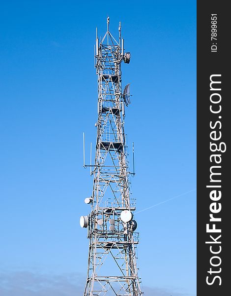 Cell tower on the blue sky
