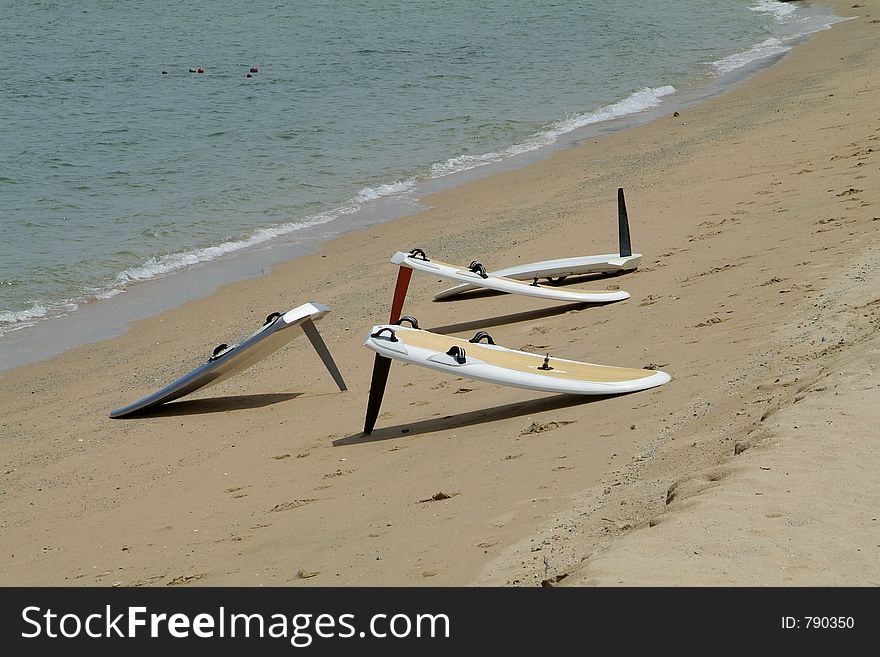 Group of four sailboards on the beach. Group of four sailboards on the beach