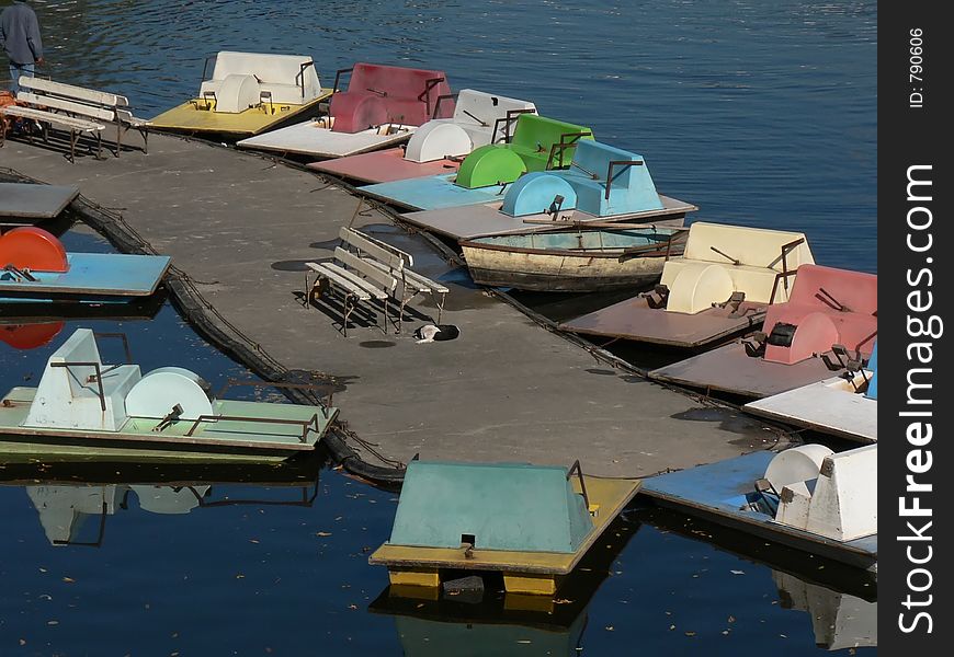 Several small boats waiting for custimers on a sunny sunday afternoon. Several small boats waiting for custimers on a sunny sunday afternoon