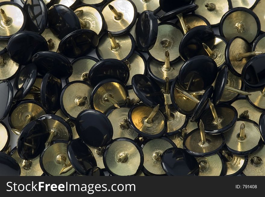 Lots of black & gold thumbtacks