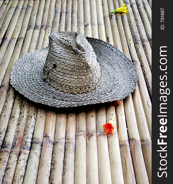 Old straw hat with flowers