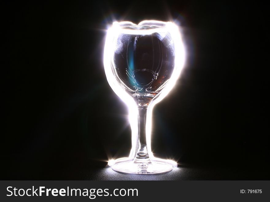 Backlit glowing goblet in the dark