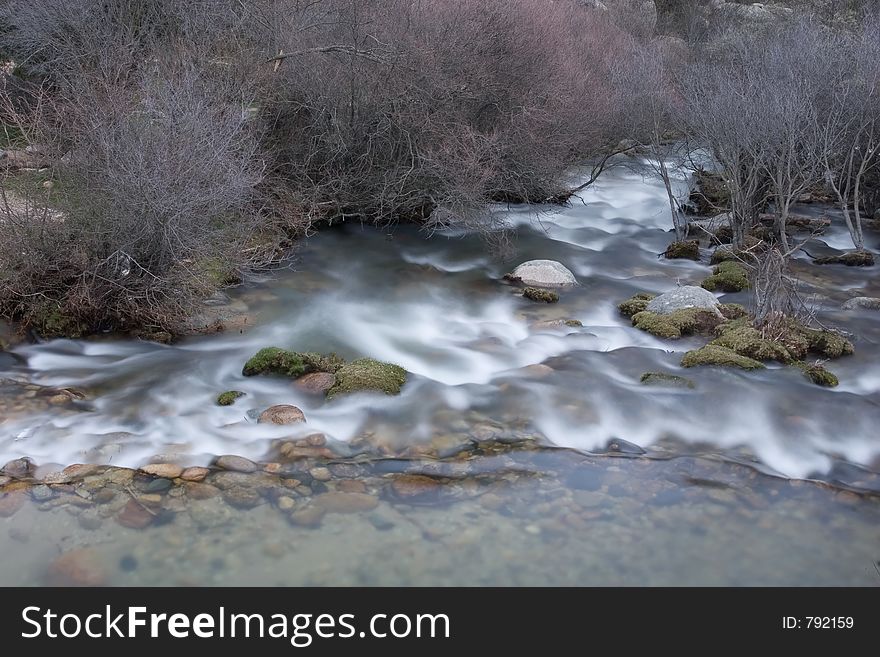 Artistic long exposure of a water in a river. Artistic long exposure of a water in a river