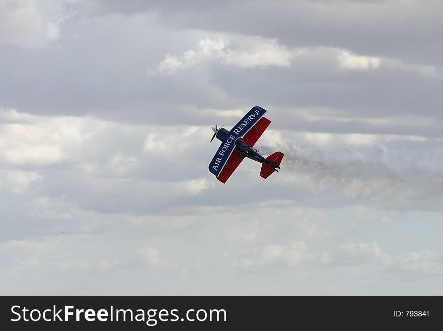 Plane performing midair tricks. Plane performing midair tricks.