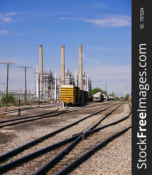 Rail lines run across a desolate industrial area