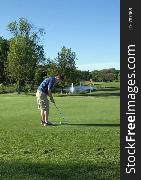 Golfer on the course in the evening. Golfer on the course in the evening