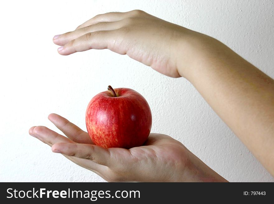 An apple on the hand. An apple on the hand