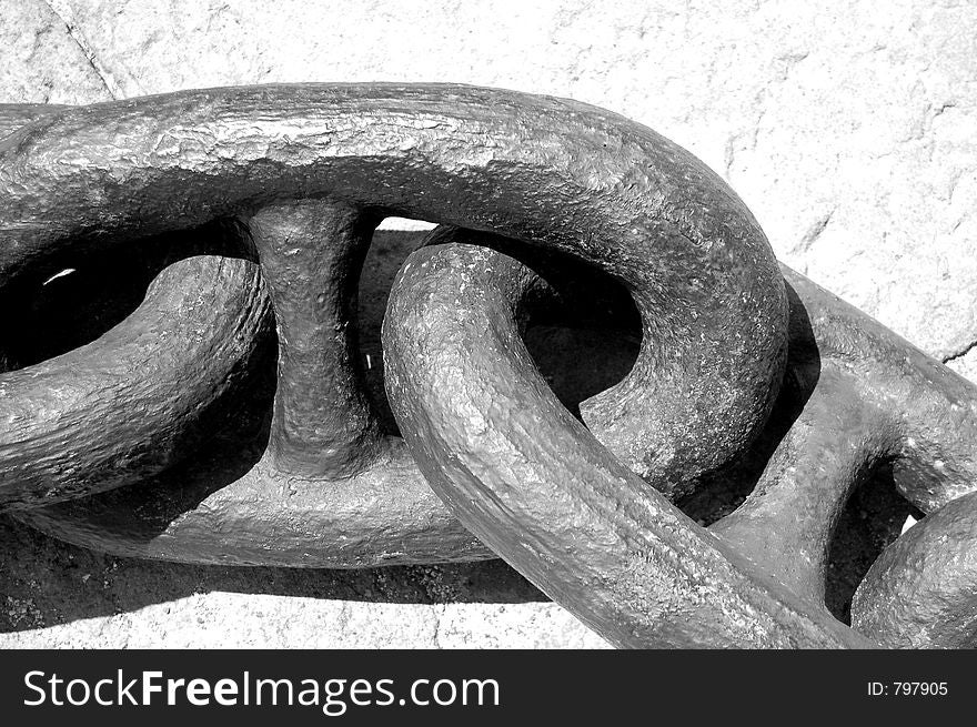 A couple of rings from a big anchor's chain in black & white. A couple of rings from a big anchor's chain in black & white
