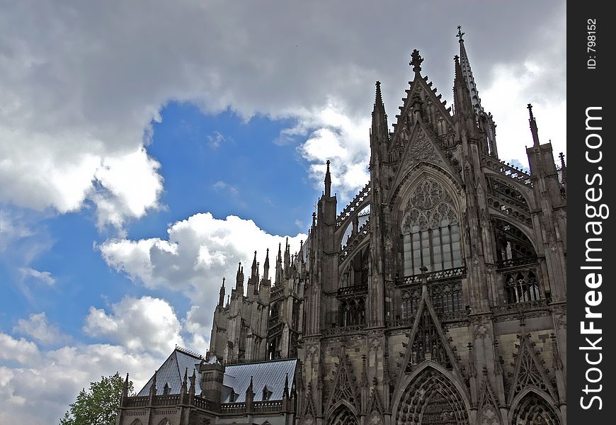 Back side of the dome in cologne with blue sky and grey clouds. Back side of the dome in cologne with blue sky and grey clouds