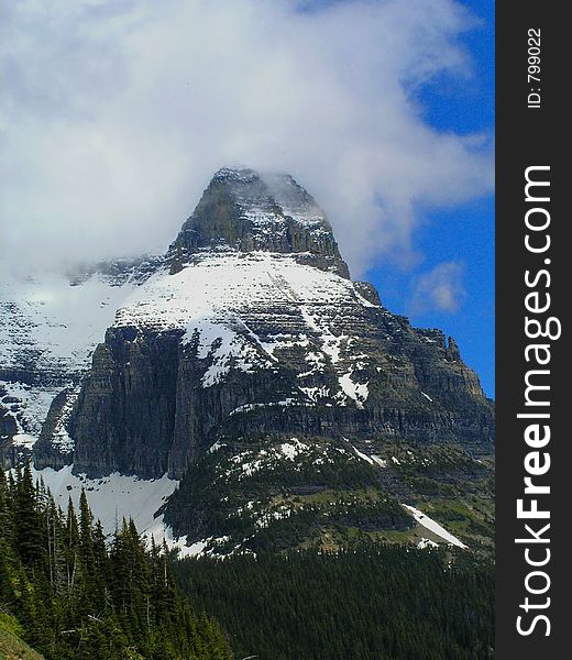 This mountain is one of the most spectacular in Glacier National Park and had some cloud cover on this particular day. This mountain is one of the most spectacular in Glacier National Park and had some cloud cover on this particular day.