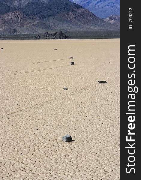 The trails of rocks that mysteriously move across the playa make crisscrossing patterns.  Death Valley, California, USA. The trails of rocks that mysteriously move across the playa make crisscrossing patterns.  Death Valley, California, USA.