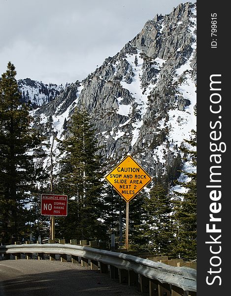 Two signs warn of the danger of the coming road.  Lake Tahoe, California, USA. Two signs warn of the danger of the coming road.  Lake Tahoe, California, USA