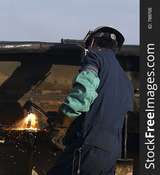 Worker burning steel. Worker burning steel