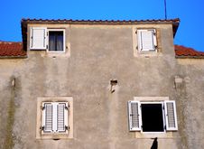 Wall With Four Windows Two Of Wich Is Open Royalty Free Stock Photography