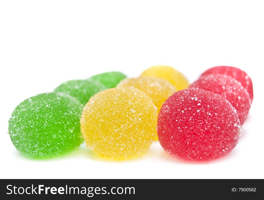 Sweet fruit color candy on white background