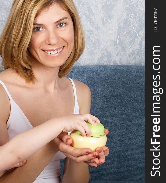 The beautiful girl with a cosmetics jar in a hand