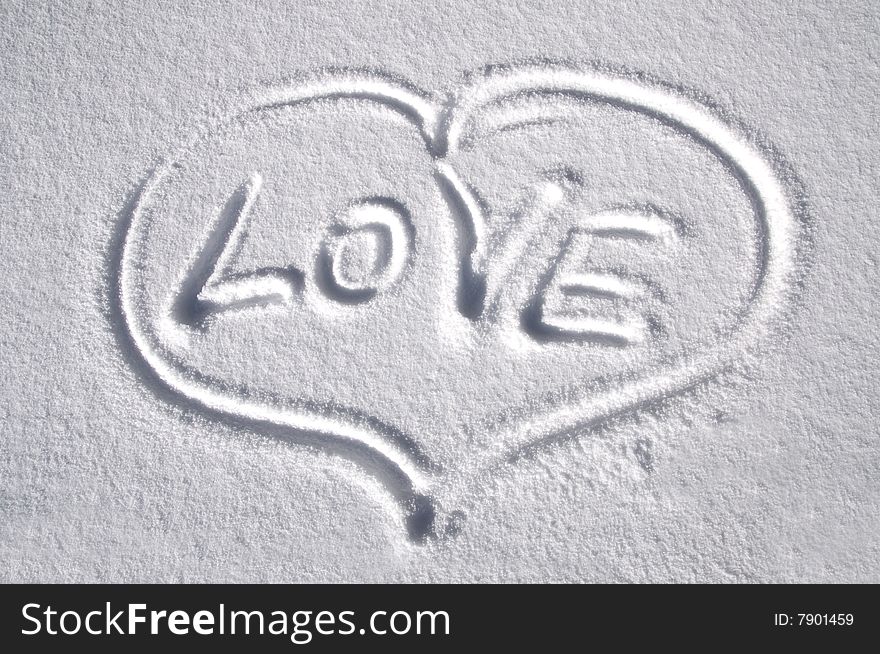 Heart drawn on the snow with title LOVE. Heart drawn on the snow with title LOVE