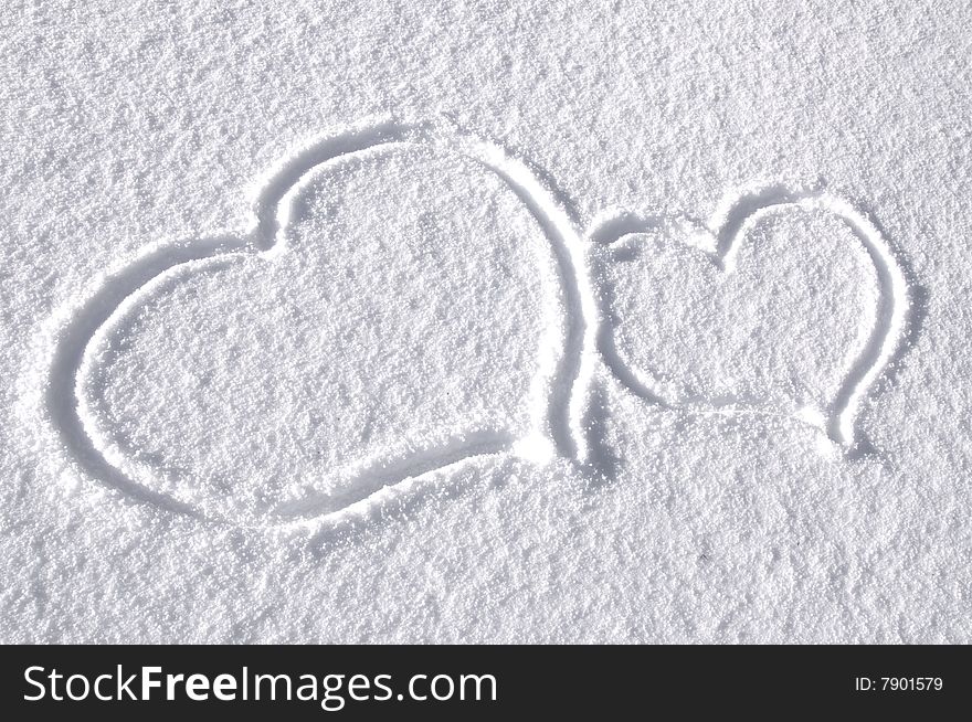 Two hearts drawn on the snow. Two hearts drawn on the snow