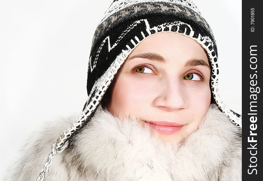 Smiling girl in a white fur-coat. Smiling girl in a white fur-coat