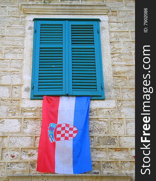 A Wall With Window & Croatian Flag