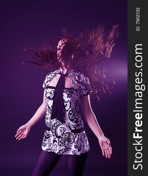 closeup portrait of woman dancing and flipping her hair