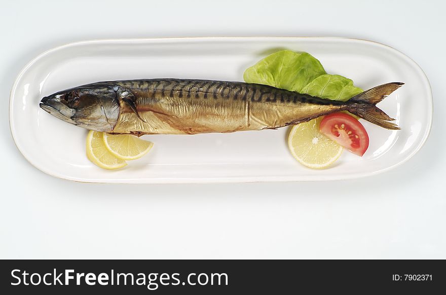 Smoked mackerel on a white platter