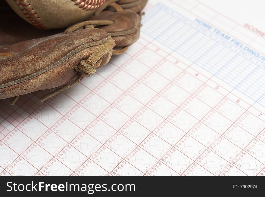 A picture of a ball and glove on a scorebook. A picture of a ball and glove on a scorebook