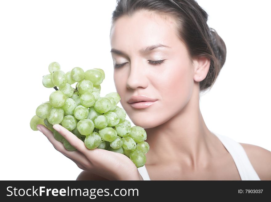 Studio portrait of a girl with a bunch of grapes isolated on white background. Studio portrait of a girl with a bunch of grapes isolated on white background