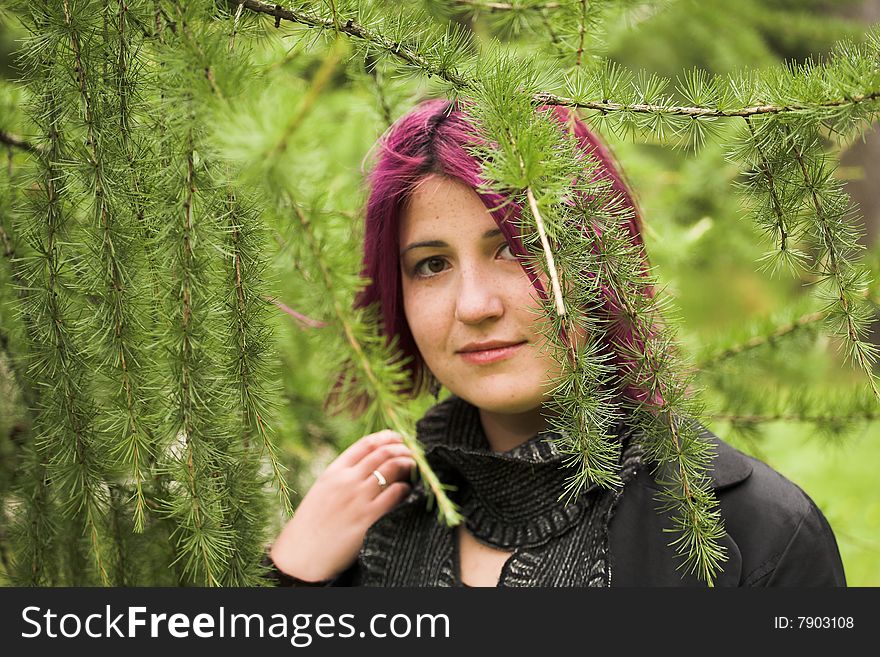 Beautiful woman relaxing in the summer park