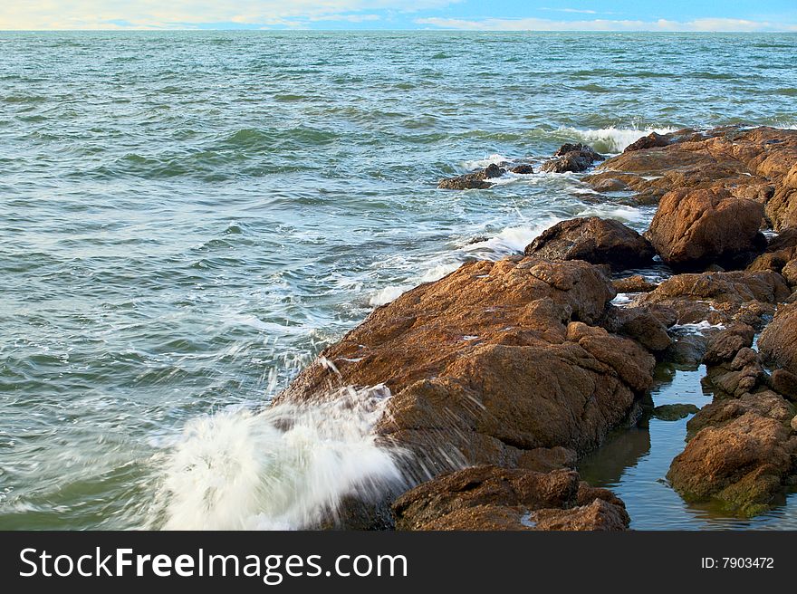 Stones, sea, wave, blue sky. Stones, sea, wave, blue sky