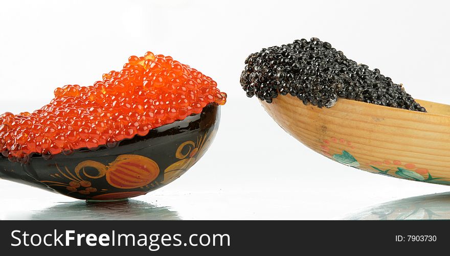Two wooden spoons with caviar. Two wooden spoons with caviar