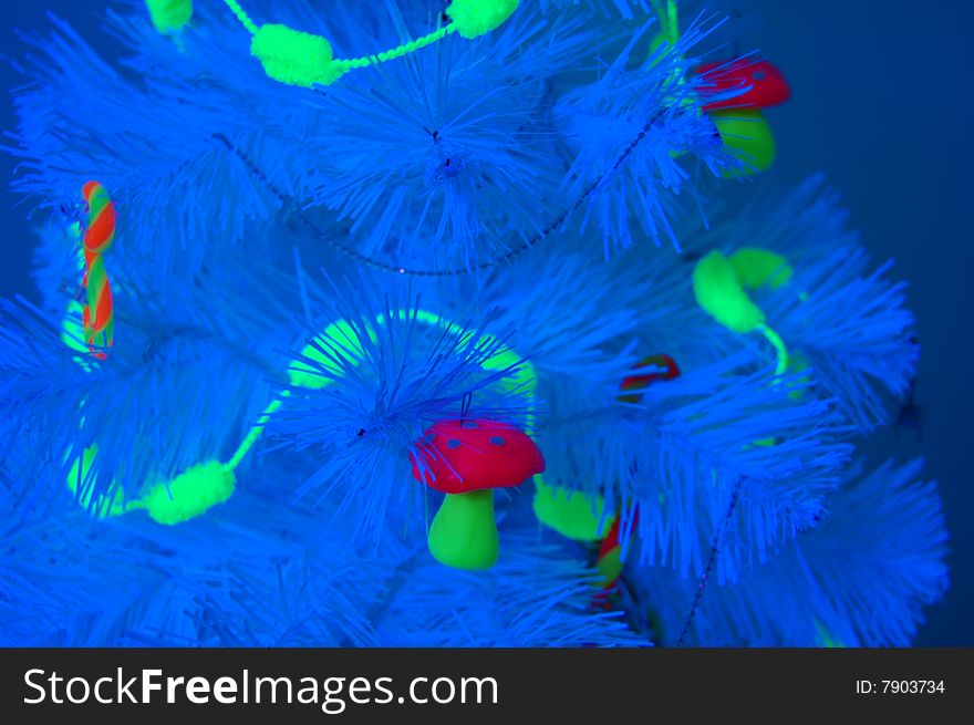 Unusual Christmas tree in a blacklight. Unusual Christmas tree in a blacklight