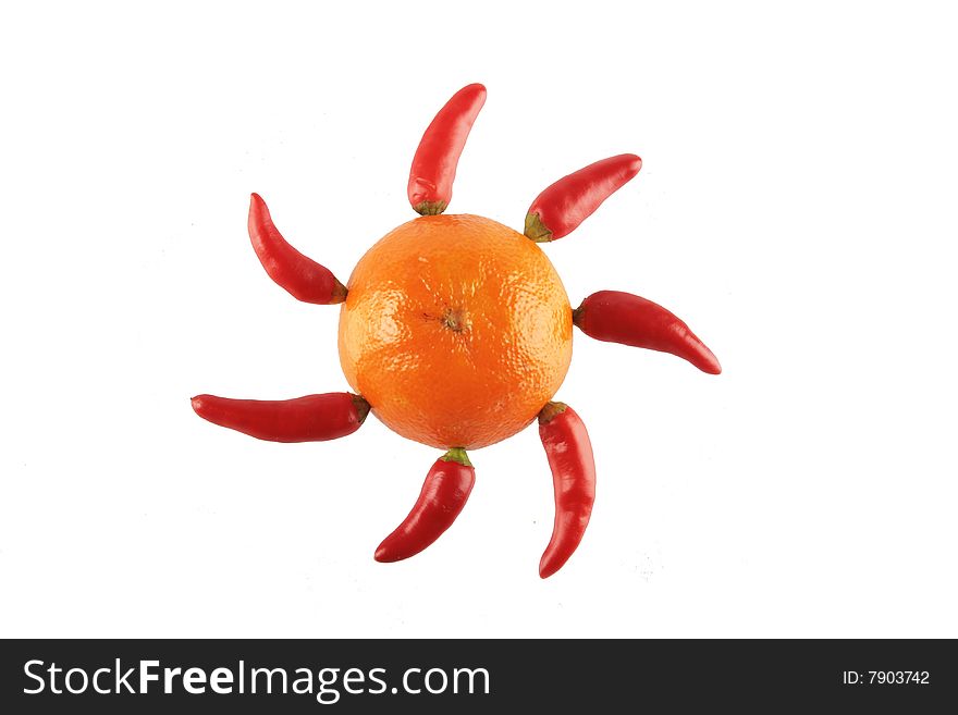 Sun made from mandarin and chili papers. Sun made from mandarin and chili papers
