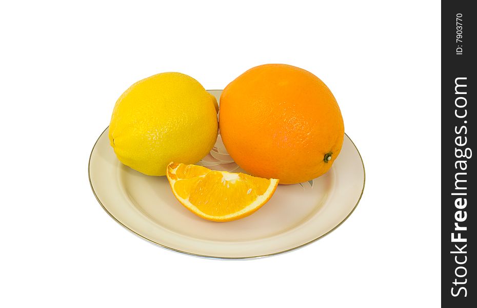 A close-up of the orange and lemon on plate. A close-up of the orange and lemon on plate.