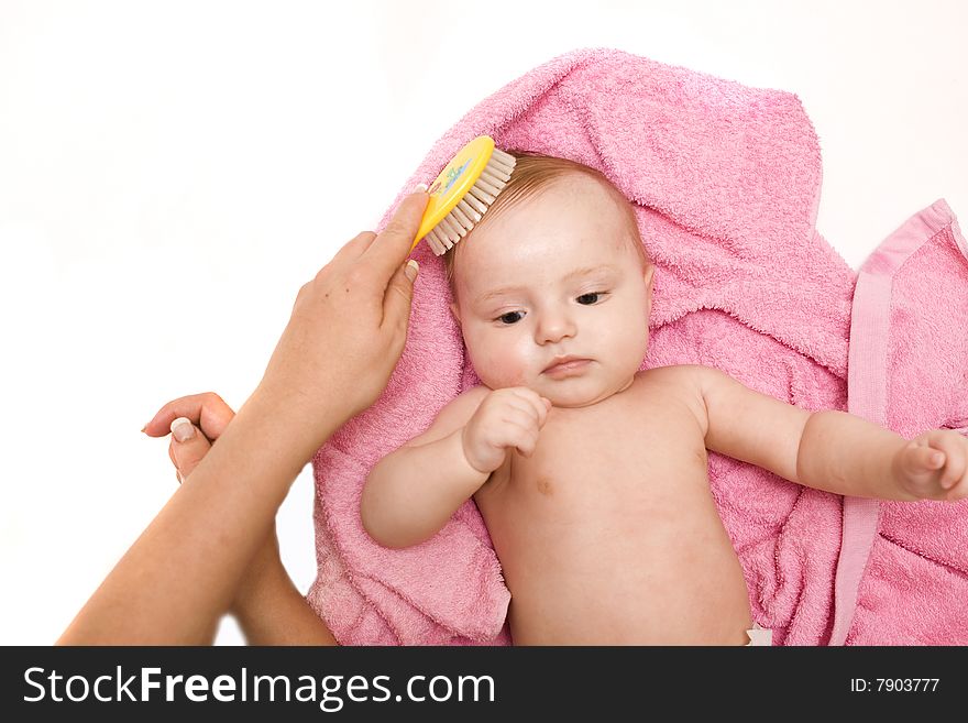 Little baby after bath on white