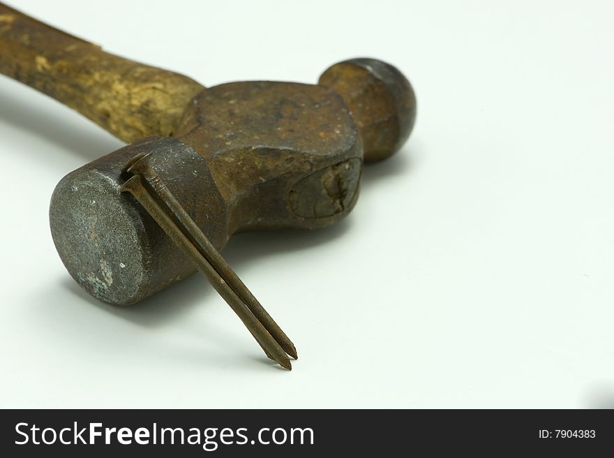 Antique hammer and nails isolated on white. Antique hammer and nails isolated on white