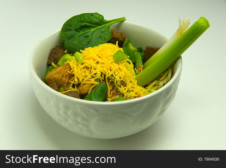 Bowl of salad isolated on white