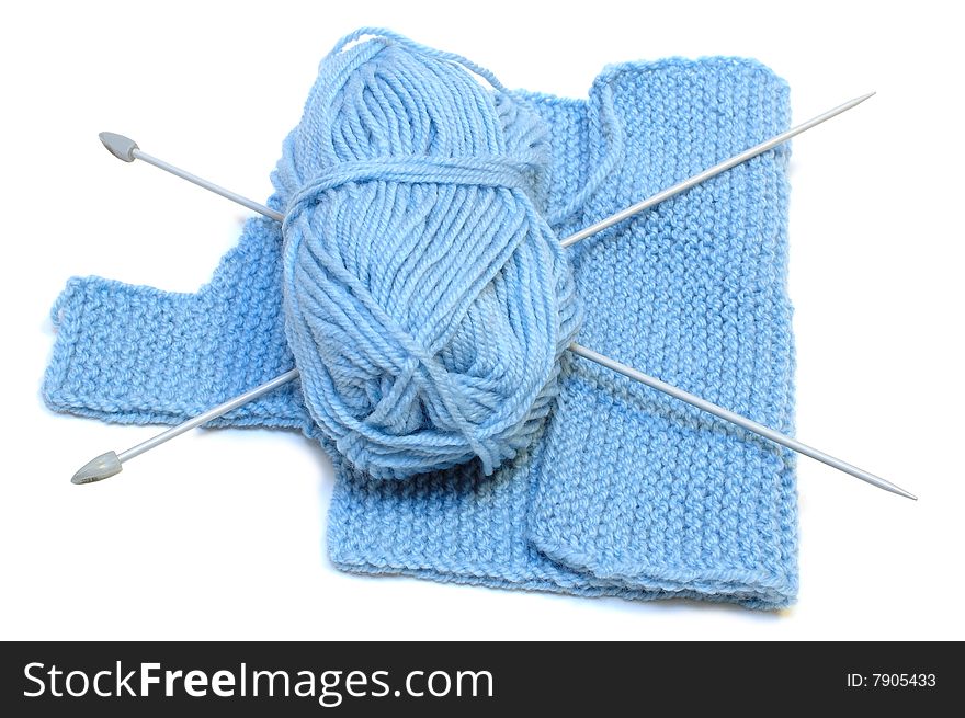 Knitting needles, yarn  and knitting cloth.