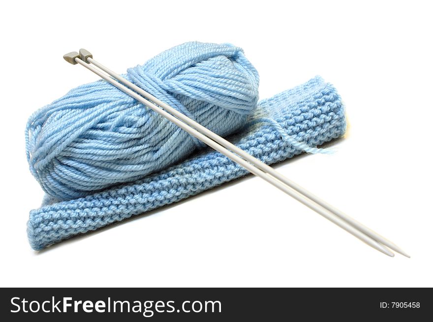 Knitting needles, yarn  and knitting cloth.