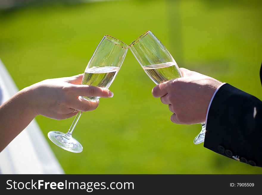 Champagne in hands of lovers. Champagne in hands of lovers