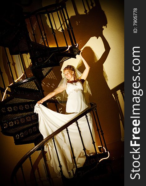 Bride posing on the staircase