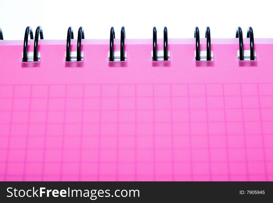Stock photo: office theme: an image of a part of a pink notebook