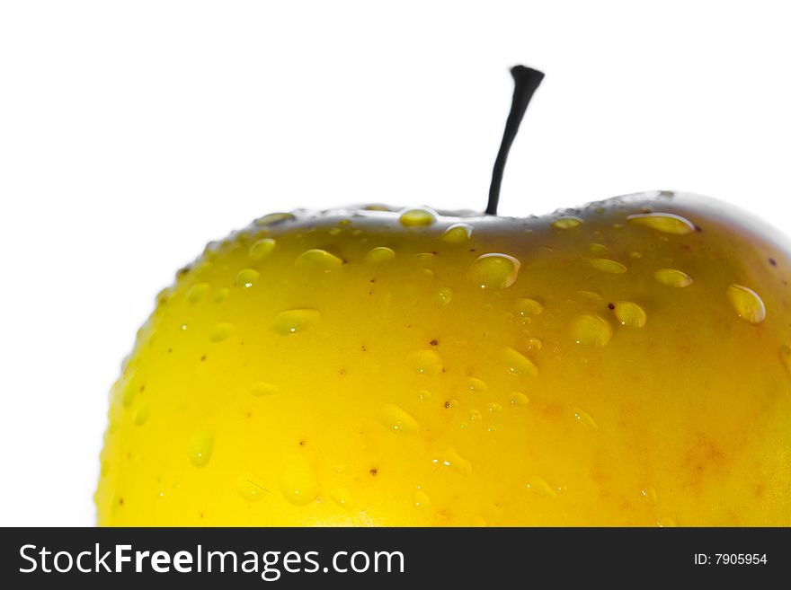 Stock photo: nature theme: an image of water drops on a yellow apple. Stock photo: nature theme: an image of water drops on a yellow apple
