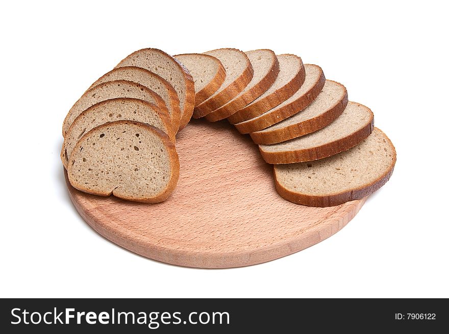 Pieces of long loaf and round board isolated on a white background. Pieces of long loaf and round board isolated on a white background.