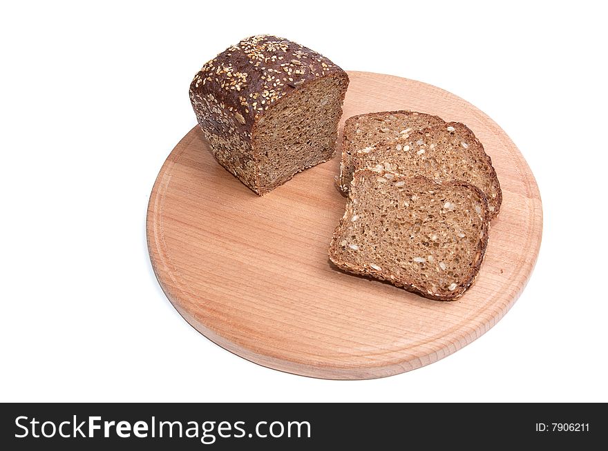 Pieces of bread and round board isolated on a white background. Pieces of bread and round board isolated on a white background.