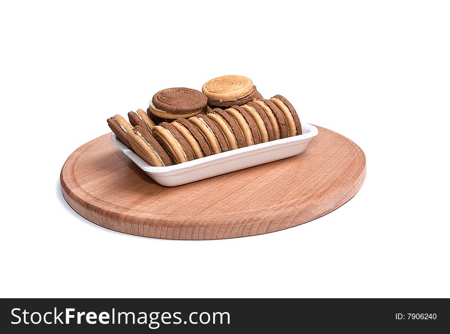 Cookie in the paper container isolated on a white background. Cookie in the paper container isolated on a white background.