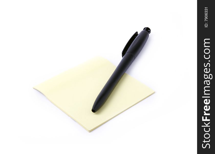 Note with pen on a white background